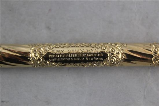 The Swan Pen. An embossed gold plated fountain pen, by Mabie Todd, 5.25in.